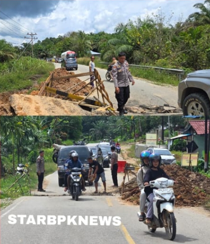Polsek Parindu Bersinergi dengan Masyarakat Lakukan Gotong Royong Penimbunan Jalan di Dusun Bali